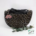 Women's Elliptical Cut Pattern Hand Bag with Keychain