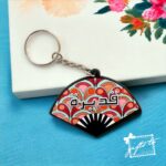 Women's Elliptical Cut Pattern Hand Bag with Keychain - Image 4